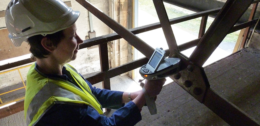 A heritage scientist scanning part of the Engine Shed's metal ceiling