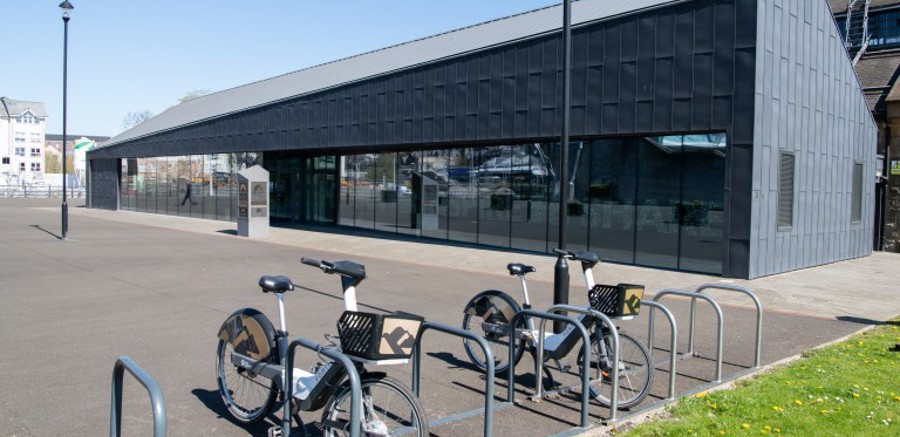 Bike racks filled with bikes outside the Engine Shed building